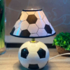 abazhur me top futbolli ne dyqan taxi